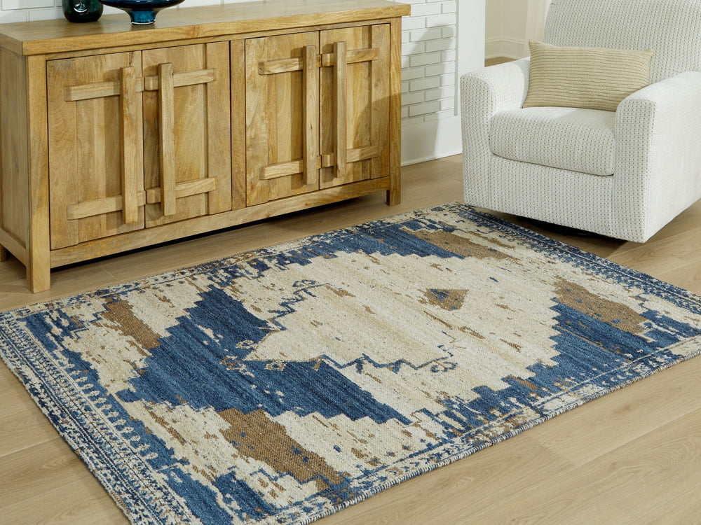 Invite a casual boho vibe into your space. Showcasing a distressed medallion design, this rug can mix and match with other accents to curate an eclectic aesthetic. Its blue, brown and tan palette exudes a relaxed feel, completing your living room or bedro