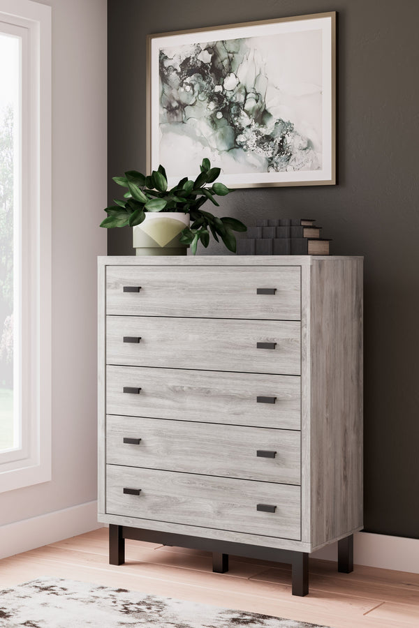  this two-toned chest of drawers brings sleek style to your space. Matte black drawer handles enhance the sheer simplicity of its profile. With this 