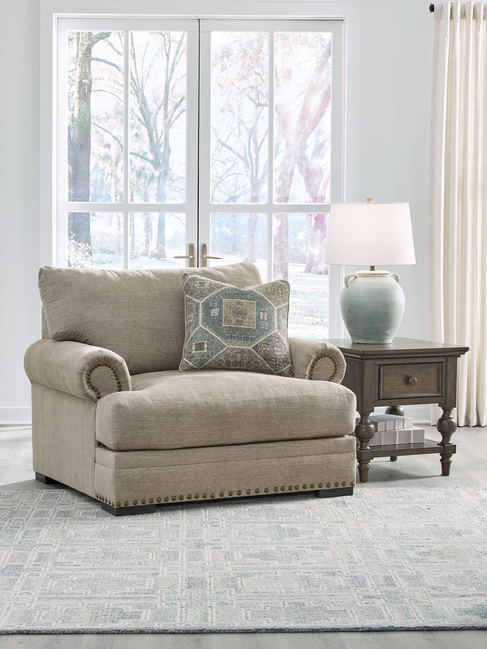 Looking to enhance your home-'s visual appeal? This sofa and loveseat set with matching oversized chair and ottoman offers sophisticated design, comfort and elegance with tonal colors, roll arms and nailhead accents. Enjoy optimal coziness as you nestle i