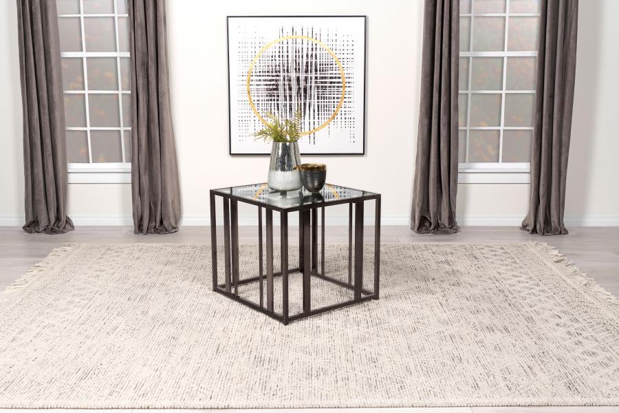 This modern side table features a tempered glass top paired with a geometric base in heavy-gauge metal with a sleek black nickel electroplated finish. The open design offers a contemporary aesthetic, blending elegance with durability. Perfect for displayi