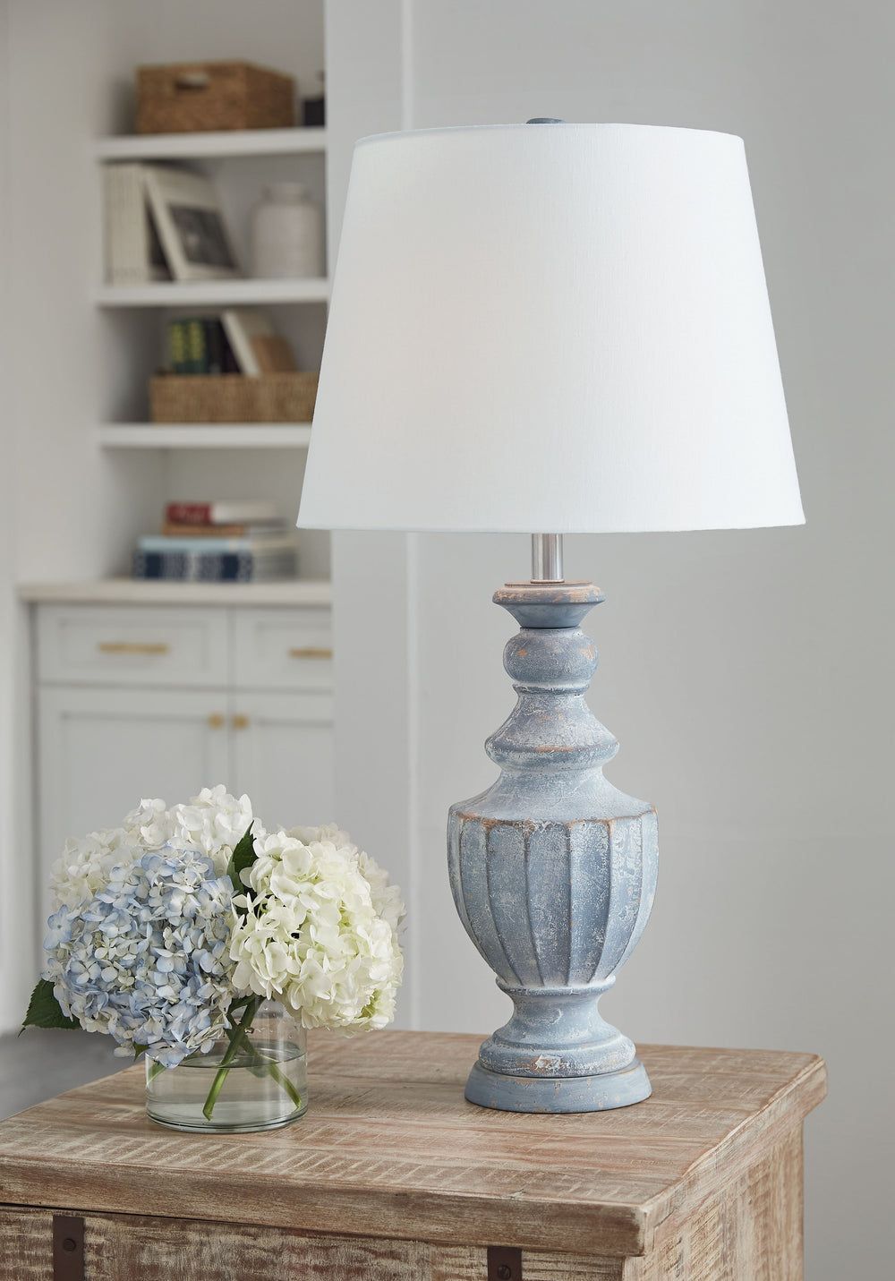 Striking in its traditional elegance, this terra cotta table lamp knows how to make a statement. Its classic urn-shaped body is bathed in an antiqued finish and topped with a fresh shade that dresses up a nightstand or end table. It-'s a bright idea that 