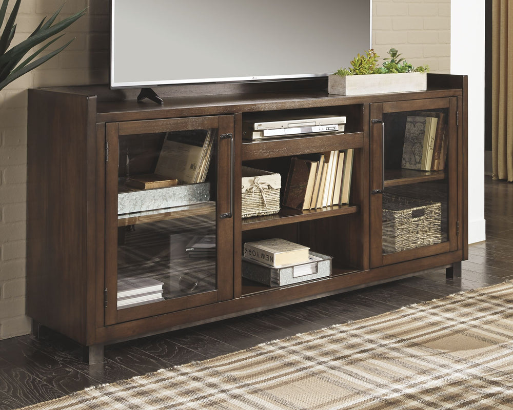 For fans of urban industrial design, this XL TV stand clearly steals the show. Its blend of acacia veneer and wood is beautified with an oiled walnut-tone finish for a highly contemporary aesthetic with grainy, earthy character. Infusion of dark bronze-to