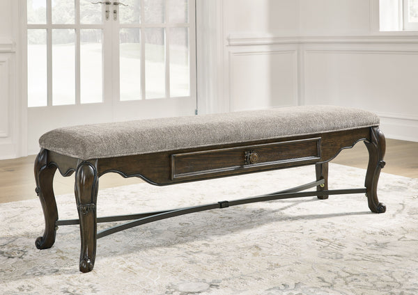  this dining bench makes a bold statement. With ornately shaped legs