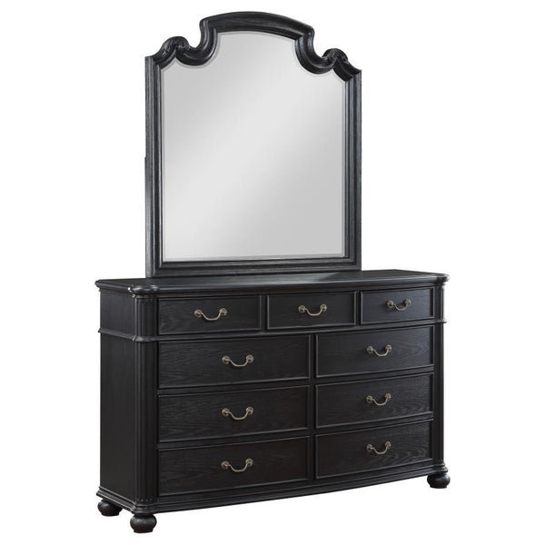 Reflect beauty and light in your sanctuary with this elegant dresser mirror. Framed in the same dark, rich tones as the set, it complements the dresser perfectly, creating a space where getting ready is done in style. The mirror invites light and depth in