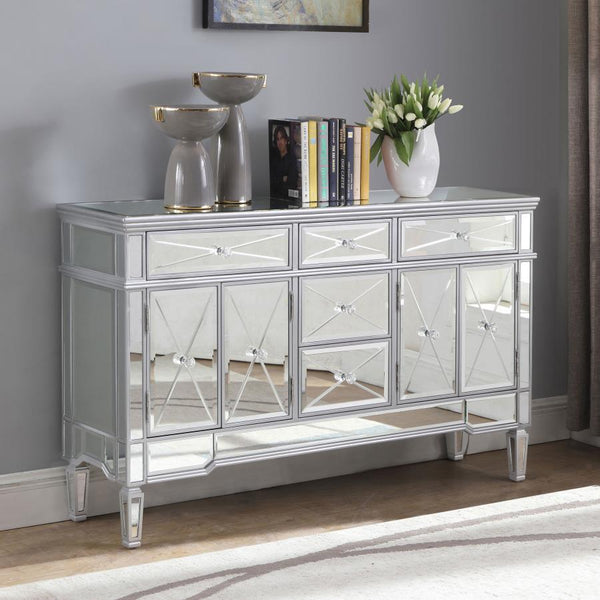  it brings modern appeal and convenience to the home. It features birchwood and MDF construction in a silver finish to match the lustrous mirrored ac