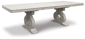 Add a touch of romance to your home with this dining extension table. The painted finish and shapely silhouette are all about easy elegance. Turning the focus on the double sculptural pedestal base, this graceful table adds a dash of upscale luxury to the