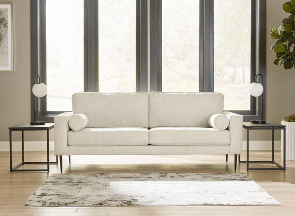  the slim-profiled piece welcomes you with its cozy character. A subtle chevron pattern on the cushions refresh the classic neutral hue