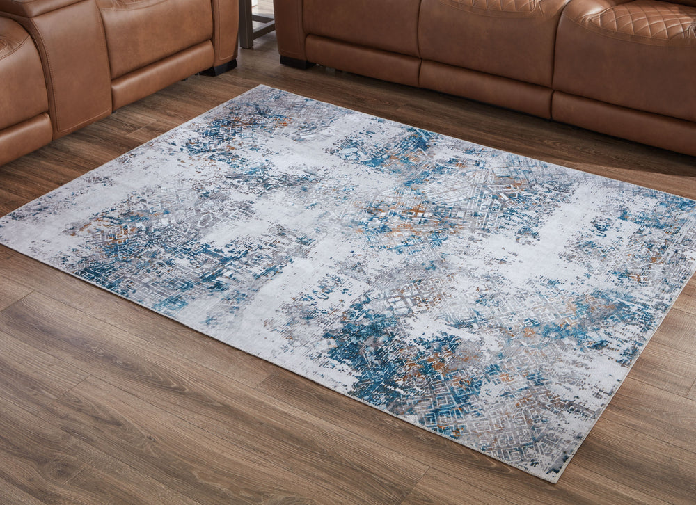 Create a modern and artful foundation on your floors with this area rug. We love how well the simple shades of blue, gray, white and honey work with decors from industrial to classic. A must-have for homes with kids and pets, this machine-washable rug is 