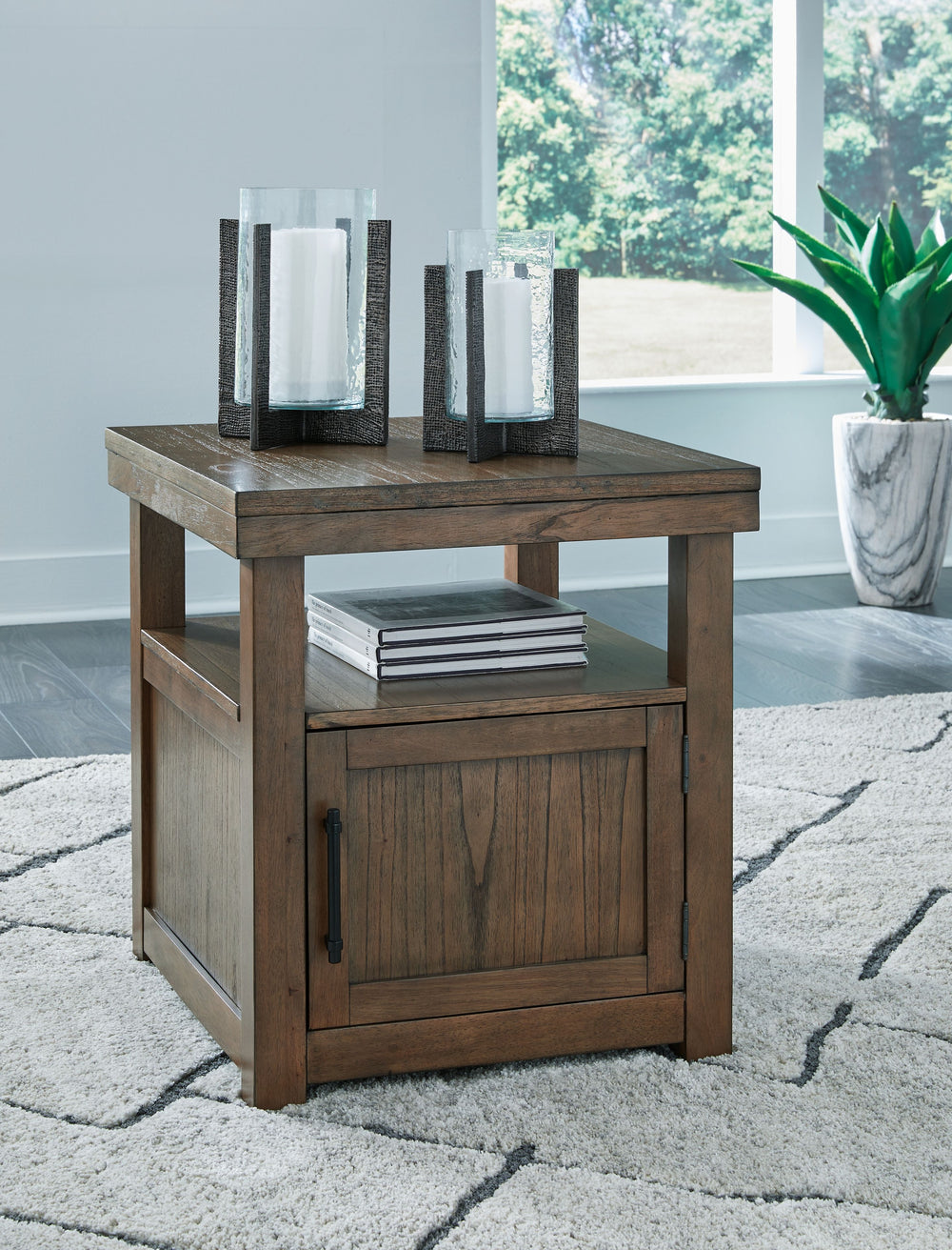 Elevate your entertainment experience with this end table. A functional companion for your seating area, itâ€™s defined by a richly versatile finish. Instantly upgrade sofa-side loungingâ€”you can decorate the top with a lamp or vase while tucking remotes