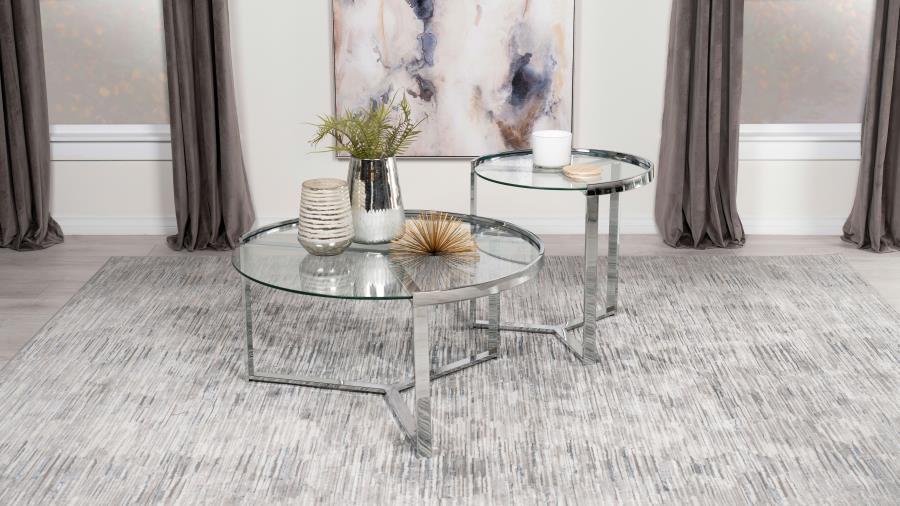 With just a bit of glam style, this casual nesting coffee table set is bright, light, and pleasing. Your living room or family room comes to life with a table set including one large and one small round table that display side by side and nestle together 
