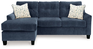  finesses the piece with just the right touch. Gently flared arms and tufted back cushion
