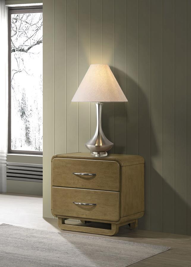 This two-drawer nightstand offers a perfect balance of practicality and modern design. The nutmeg wood finish provides a warm, natural look, while the rounded edges contribute to a sleek, contemporary style. Metal extension glides ensure smooth drawer ope