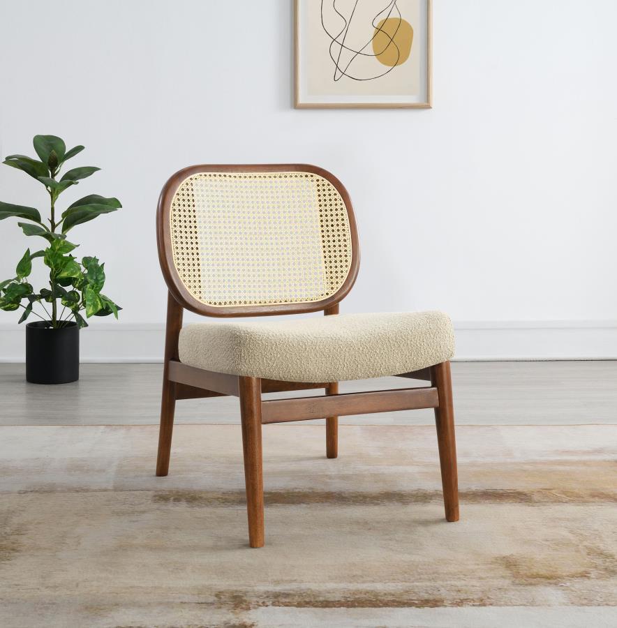 This accent chairs introduces a warm, airy presence to any living area. Lounge chair features a rattan open cane webbing back that breathes natural style and a fabric upholstered cushioned seat for soft, supportive comfort. The solid hardwood frame provid