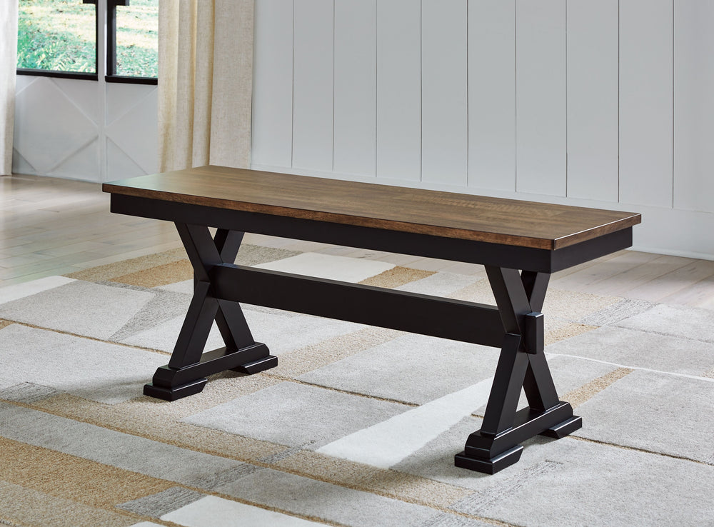 Raise the bar on modern farmhouse style with this dining bench. Its casual good looks are accentuated with a handsome two-tone finish. A sturdy silhouette adds a hearty element, whether your style is vintage, country or eclectic. This richly crafted seati