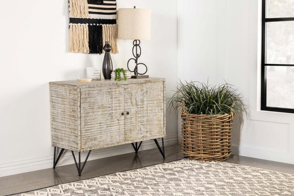  rectangular frame grounds a focal wall and welcomes a table lamp and decor along its narrow top surface. Double cabinet doors open up to r