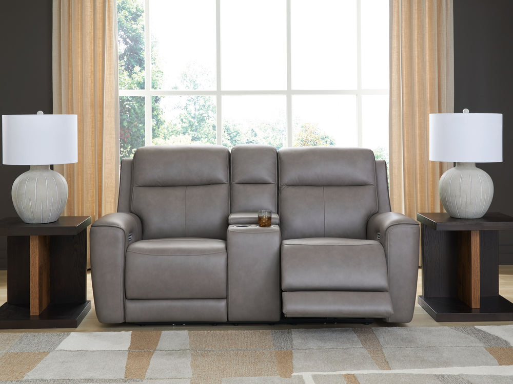 Masterfully blend high style and must-have comfort with this power reclining loveseat. Its clean, transitional look is crafted with luxury in mind, complete with supple top-grain leather in the seating area. Eloquently incorporated into the sleek design a