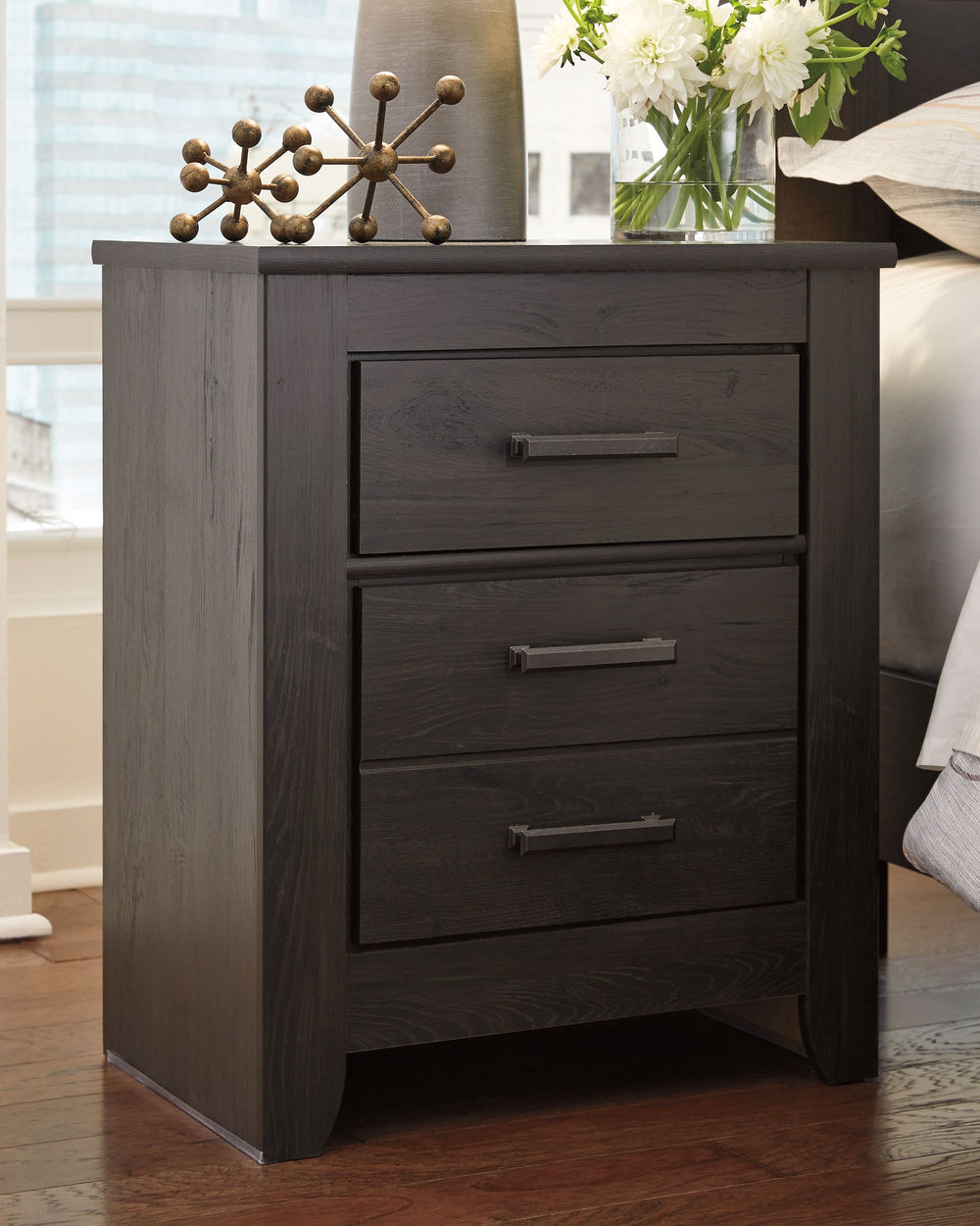 Priced to entice and styled to impress, this alluring nightstand is urban sophistication with a decidedly relaxed air. Itâ€™s got the crisp, clean lines of a contemporary piece, but with an earthy element. Replicated oak grain effect gives the chic charco