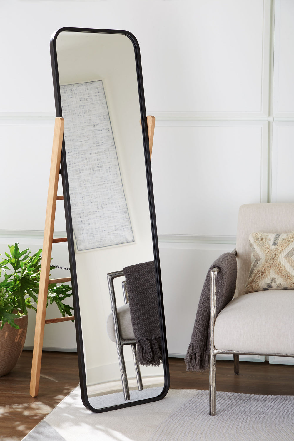 Simply striking. With the cleanest of lines and the perfect merger of contrasting light brown and black finishes, this floor mirror is the very essence of cool, contemporary design. Its full-length style is an ideal choice for so many spaces.<br><br><b>Ad