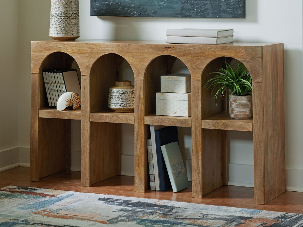 Sporting an arch design, this console sofa table is a striking statement piece for lovers of casual design. Talk about style with purposeâ€”crafted of mango wood in a natural brown finish, this piece delivers space to show off decor on top and rest a few 