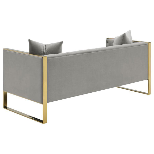  and armchair that lend a Hollywood Regency flair. Wrapped in a soft and light grey velvet upholstery
