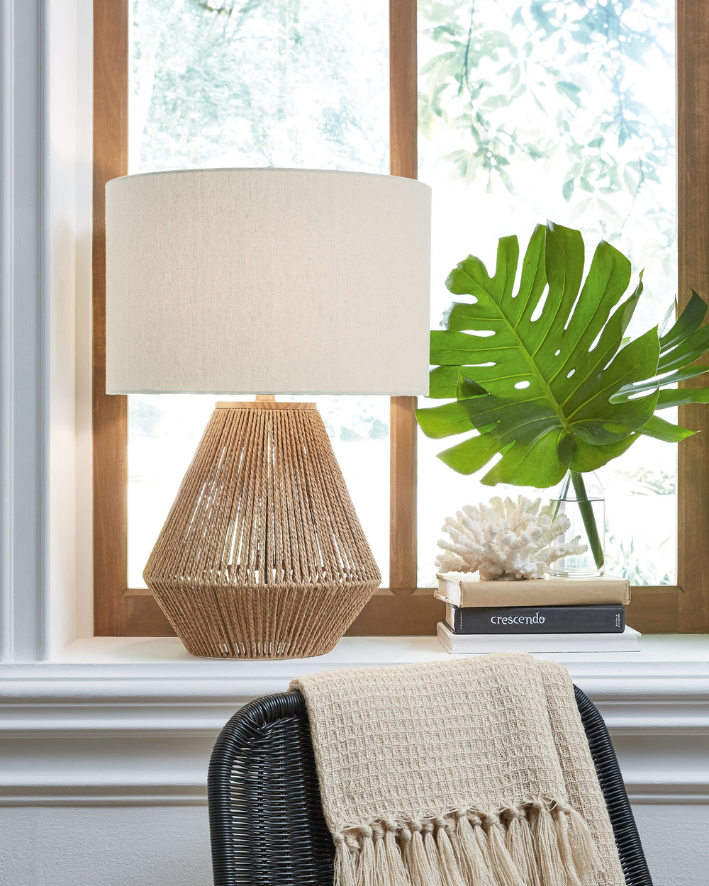 A coastal aura runs through the roped structure of this table lamp. The light and airy fixture, with a robust body, has a bohemian sense of style to create warmth and brightness in your beach house bedroom or eclectic living room.<br><br><b>Additional Dim