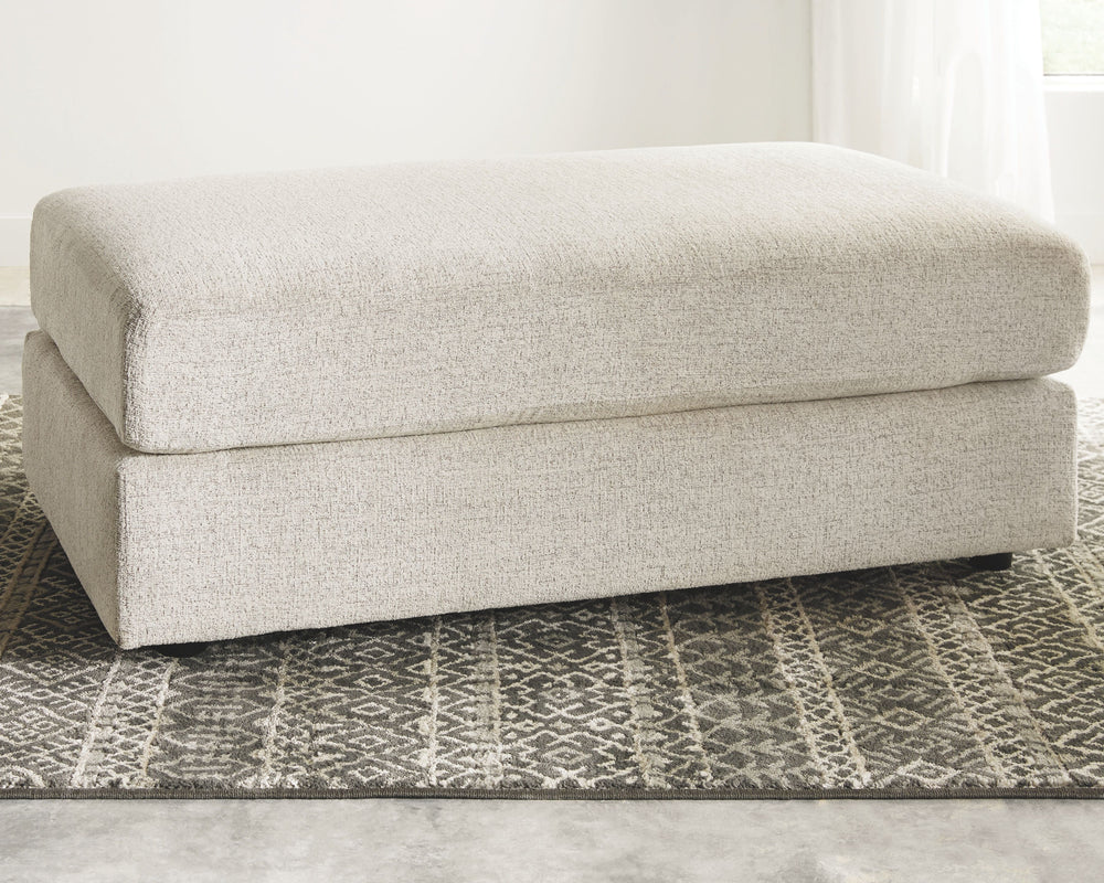 Flaunting a trendsetting silhouette, this oversized accent ottoman puts the contemporary in your contemporary home. Its ample surface space gives you elongated plushness for foot relaxation. And the chunky chenille fabric satisfies your need for a piece t