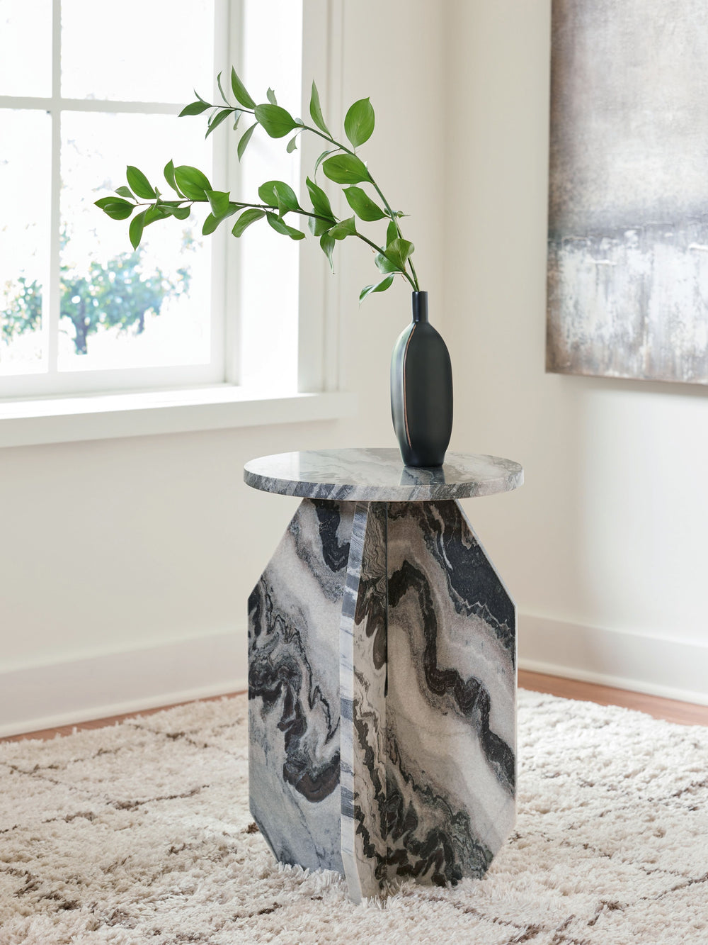 Make a big impact with this stunning accent table. The elegant all-marble construction and sculptural base create a contemporary aesthetic that-'s sure to make an impression. It-'s drop-dead gorgeous and functional, completing your seating arrangement wit