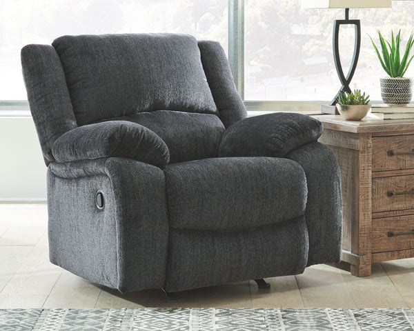  this rocker recliner lets you kick back in reliable style. The thick