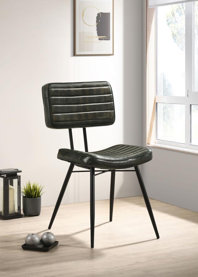 Blending industrial edge with vintage charm, this dining side chair is a striking addition to any dining space. Upholstered in hand-dyed genuine goat leather, the padded seat and backrest offer both comfort and durability. Vertical tufting details enhance