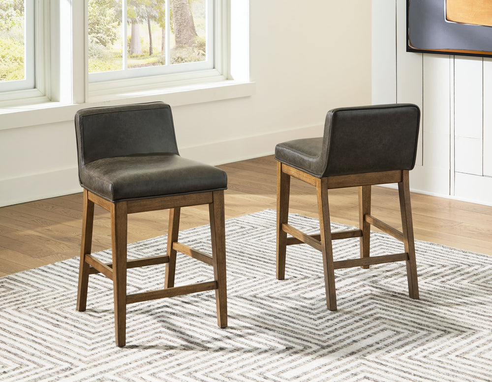 Define your dining space with reliable function and style. This counter height bar stool sits comfortably at the intersection of modern lodge and casual lifestyle aesthetics. Charming architectural elements and a light brown glazed finish reflect your war