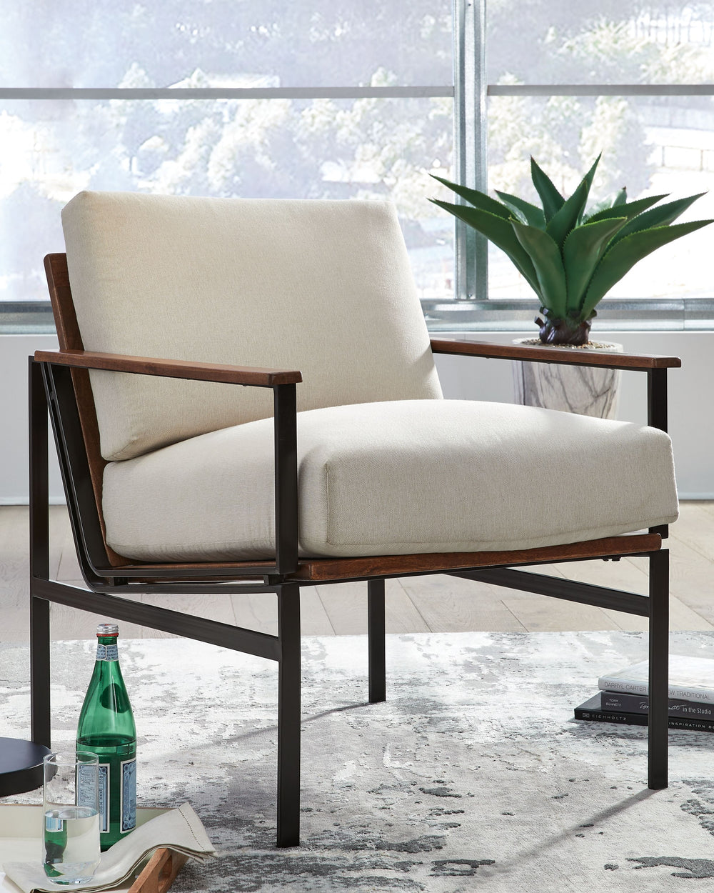Unwind after a busy workday when you rest in this beautiful accent chair. A durable metal frame delivers intriguing industrial style with a rugged look as it ensures long-lasting stability. Plush, foam-filled cushions are wrapped in lovely fabric upholste