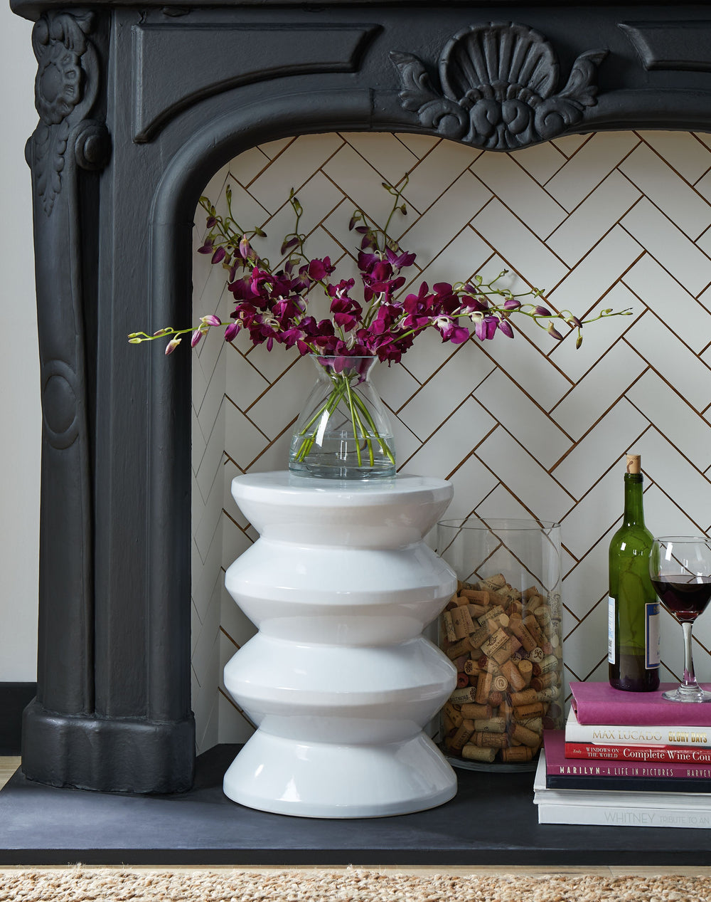 Become enamored by the bold curves of this accent stool. A white glaze gleams against the dynamically designed ceramic piece, supporting house plants, decor or your beverage of choice in simply stunning style. This versatile piece is indoor-outdoor safe.<