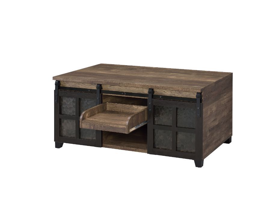 The rustic wooden frame and industrial metal accent complement each other perfectly. The coffee table embodies a raw, utilitarian aesthetic that adds a strong design presence to the space. Two sliding barn doors with obscure glass insert offer both privac