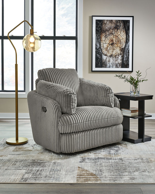  this recliner envelops you in comfort with its barrel shape and soft cord upholstery. It reclines