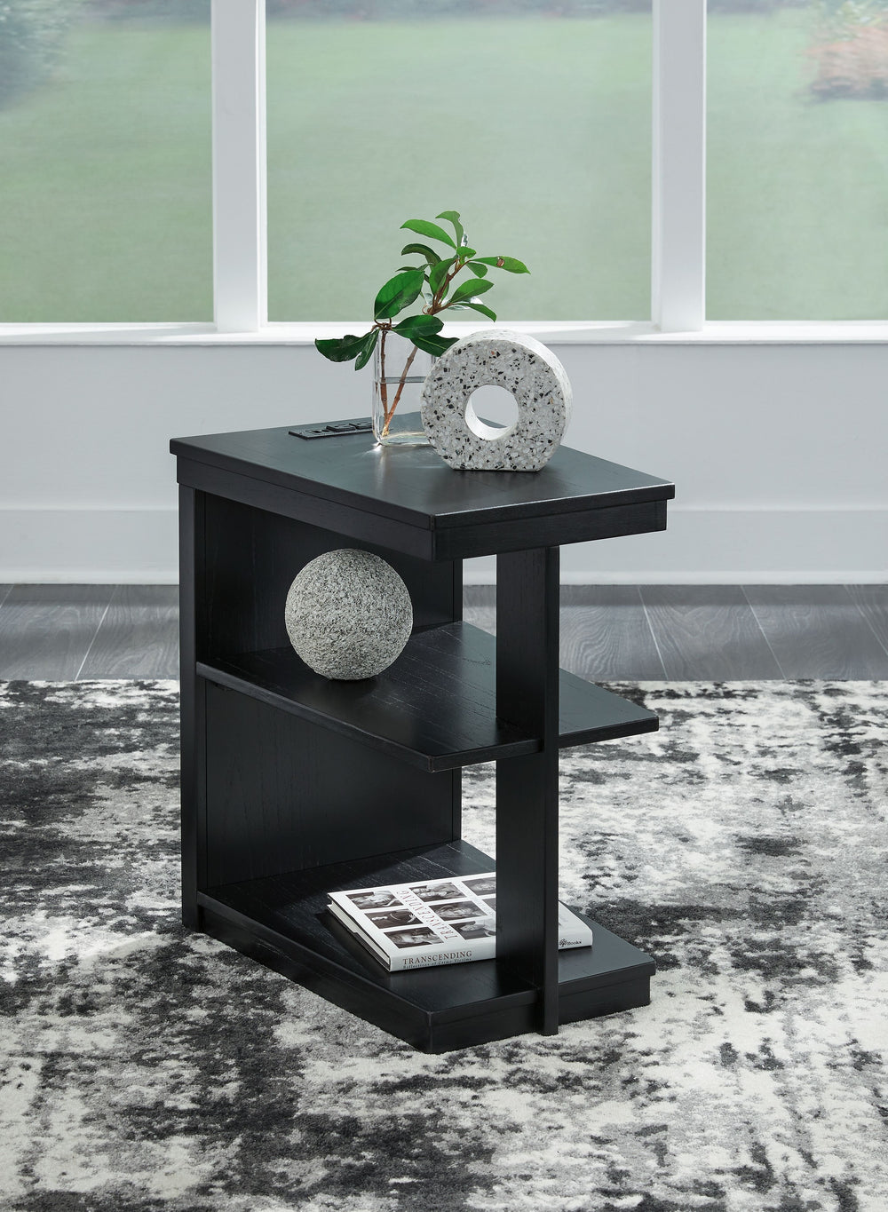 If you are a lover of simplicity, this chairside end table is the perfect choice. Its black finish, casual contemporary design and spacious storage capacity provide functional style wherever itâ€™s displayed. And with conveniently located USB charging por