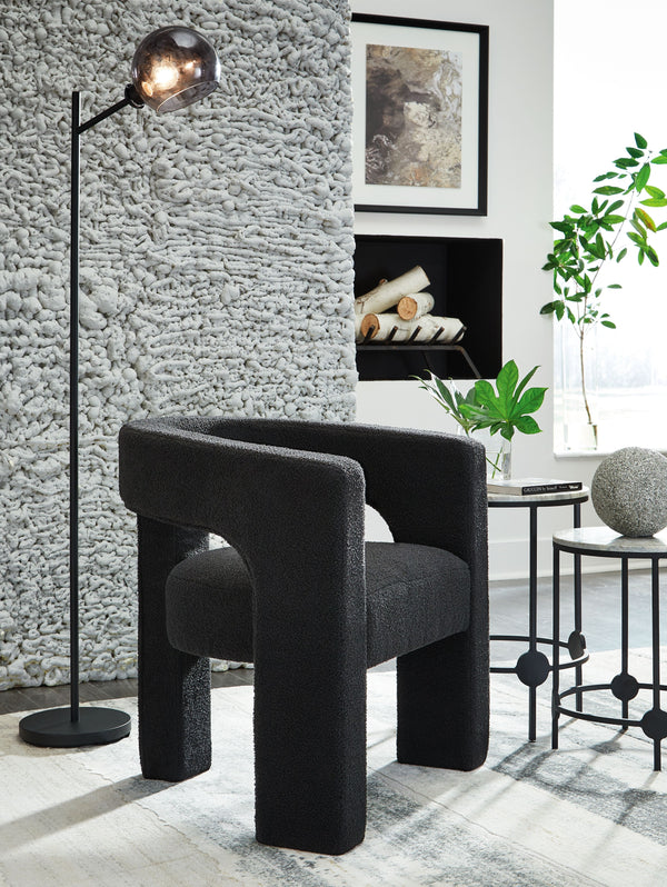  this accent chair exudes runway-inspired style. Peek-a-boo styling and decadent boucle upholstery combine both fashion and comfort seamlessly. Who says cutouts are just for your wardrobe?<br><br><b>Ad