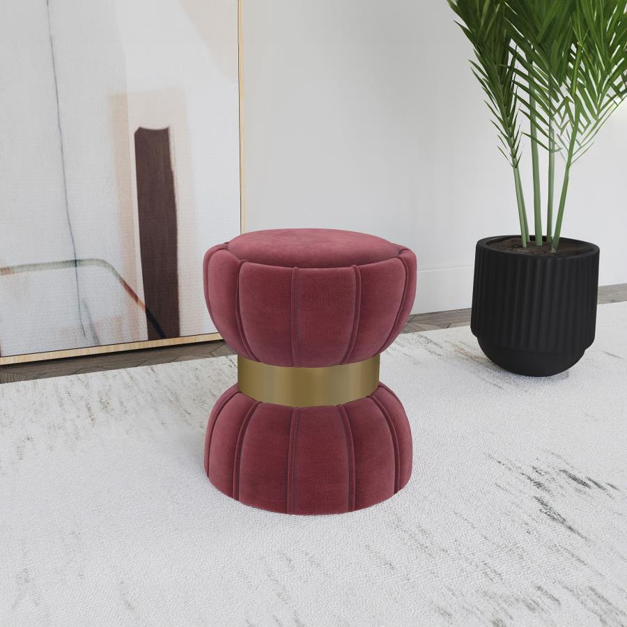 Put finishing touches on a chic decor with a modern glam ottoman. Its hourglass silhouette is playful and elegant, with a wide band highlighting in a bright gold finish. The round ottoman is a compact addition, offering a perfect spot to prop your feet. I