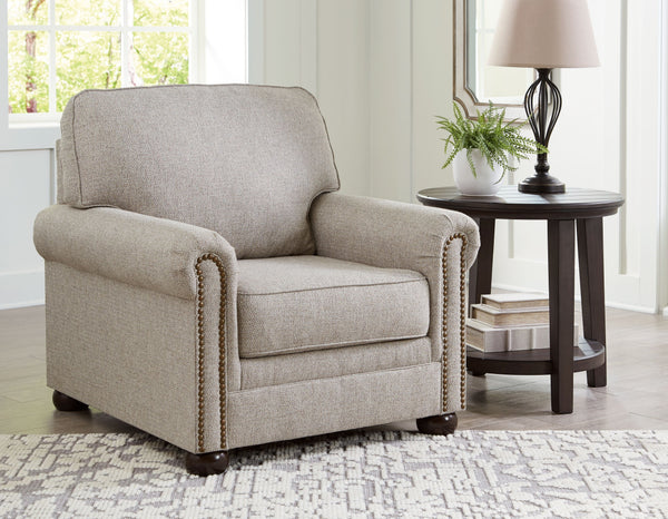  this chair complements your transitional seating area. Its versatile upholstery is delightfully detailed for a subtle herringbone effect. Designer touches like decorative nailhead trim and bun legs ad
