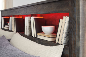  rustic and industrial styles can make one happy marriage. Case in point: this queen bookcase bed with storage. A refined take on barn board beauty