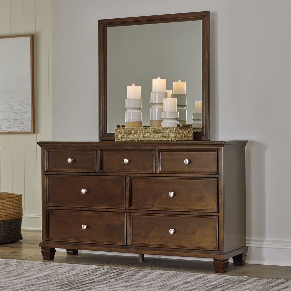 The casual design of this dresser and mirror introduces a time-honored look to your restful retreat. Spacious enough to hold all your essentials, this beautifully crafted piece is built to last with distinctive framing that gives the drawer fronts brillia