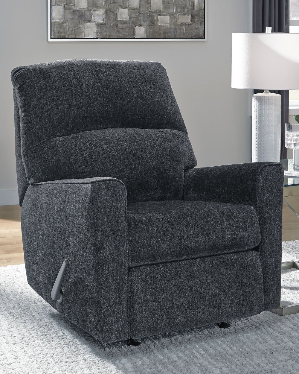  then this rocker recliner is the answer. Its clean-lined profile is beautifully contemporary. Plush chenille fabric and plump cushioning make it so easy to comfortably kick up your heels. And the recliner-'s richly neutral hue co