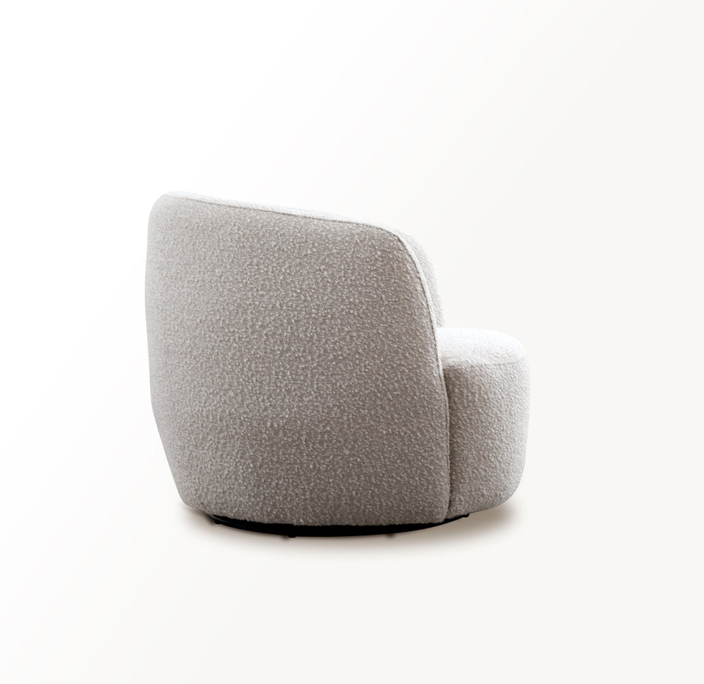 This swiveling accent chair updates your living room with a playful, modern look. It-'s made with a kiln-dried solid pine wood frame with a streamlined barrel silhouette. The design features a curved back with foam padding and a seat bolstered with sinuou