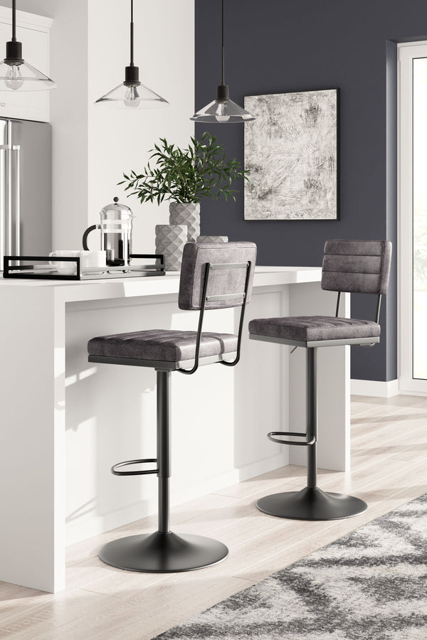  it-'s dressed to impress with a metal frame and a cushioned seat and back wrapped in gray faux leather. Along with the bar stool-'s smooth-gliding swivel
