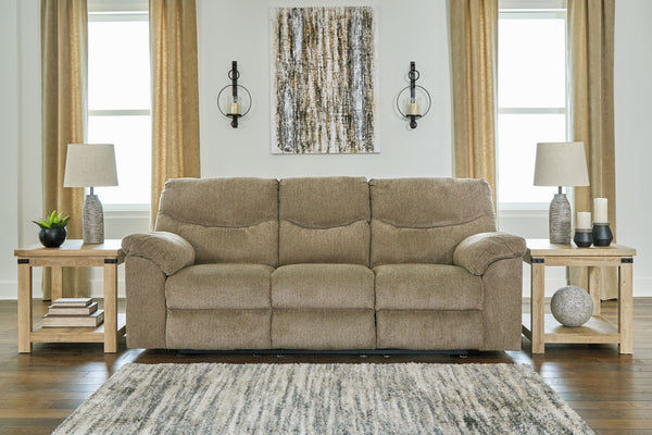  this reclining sofa invites a relaxed sensibility into your space. Its beige upholstery has a universal appeal