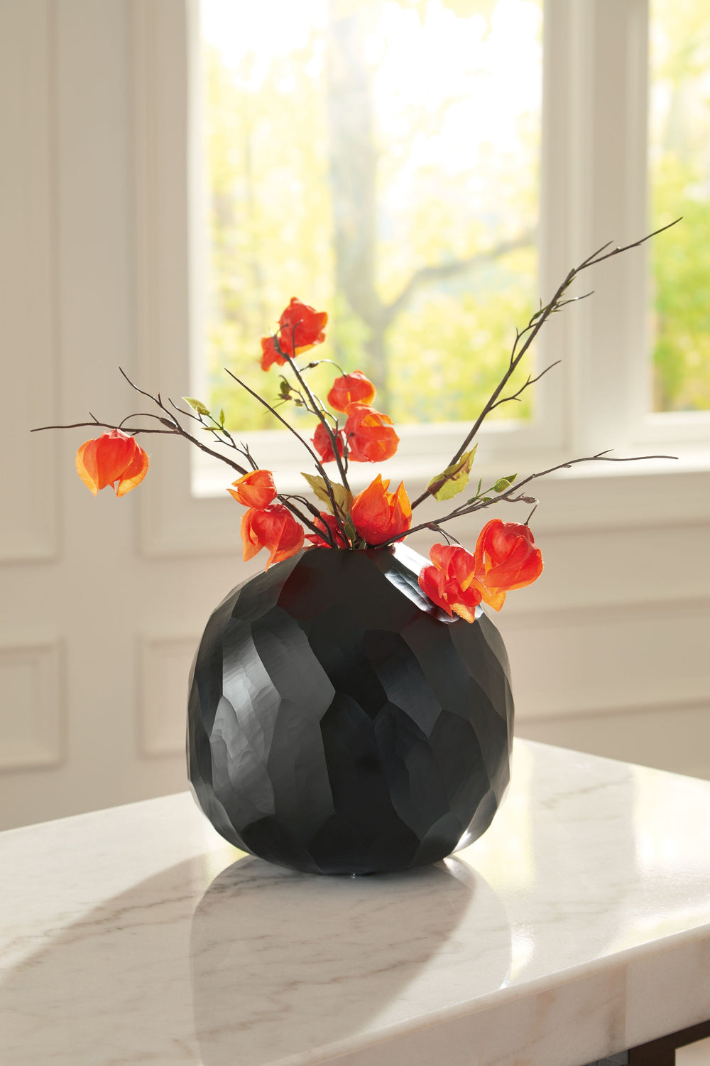 Put the accent on contemporary style with this vase. Wowing with multiple hand-carved facets, the cool black glass delivers true textural appeal from every angle. Itâ€™ll bring an artful touch wherever you see fit.<br/><br/><b>Product Features</b><ul><li>