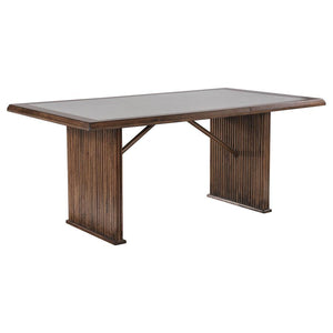 Enhance your dining space with this elegant 72-inch dining table. The reeded base adds texture and sophistication, combining beautifully with its robust construction from Asian hardwood and engineered wood. A sleek ceramic top provides a smooth, durable s