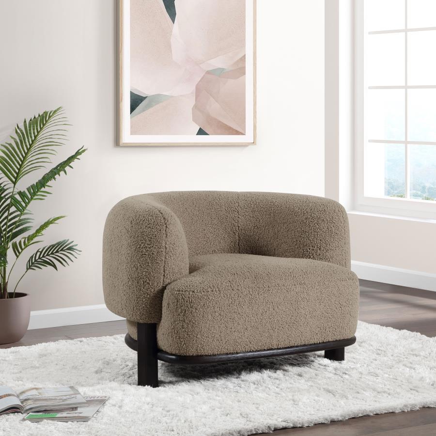 Build a refined, approachable living room aesthetic around this charming modern accent chair. It-'s a barrel back silhouette that impresses with strong, enduring lines that create a welcoming ambiance. Heavily textured upholstery adds neutral allure, perf