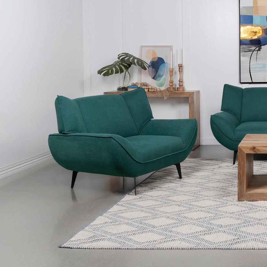 Extra width is extra comfort for lounging and reading in an easy, stylish chair with mid-century modern vibes. This comfy and stylish chair is a great choice for more compact spaces and apartments, or as a partner to a seating ensemble. Gorgeous teal fabr