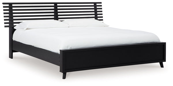 Sophisticated style for the savvy shopper. This panel bed prioritizes affordable, on-trend design. Its subtle replicated texture recalls the natural beauty of wood, highlighting the slatted styling. And a matte black finish savvily suits different approac
