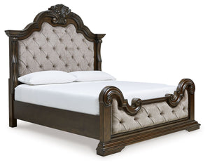 From its ornamental appliques to its large scale, this California king upholstered bed makes a bold statement. Showcasing sculptural ornate details and button tufting, this opulent bed wows with stunning style. The look is timeless. The feel? Right at hom